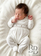 B0272 - Ivory Velour smocked babygrow.